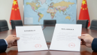 Foreign investment legal documents with world map and China flag